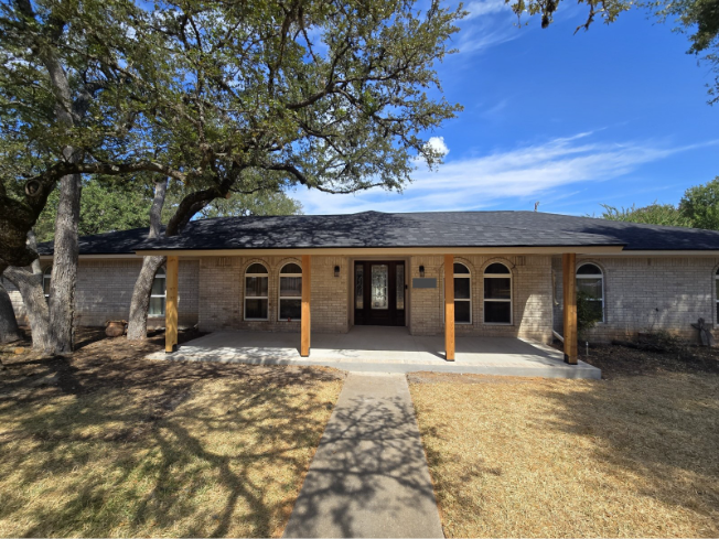 The completed covered front porch in Northwest Austin, with cedar posts and a new concrete surface.
The completed covered front porch in Northwest Austin, with cedar posts and a new concrete surface.
