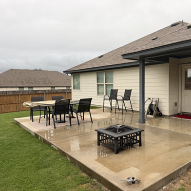 Title: Before - Description: Leander backyard patio area before a House Doctors of Austin outdoor-living project.
