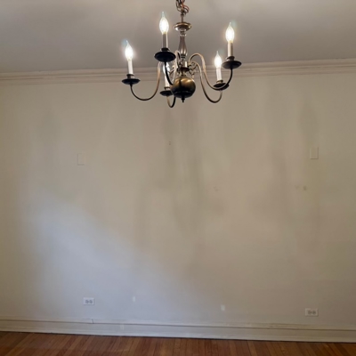 Before - empty dining room wall - All trim was removed and retained to be reinstalled over built-in cabinets Photo