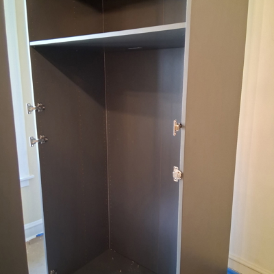 Second Ikea Pax cabinet in process of assembly Photo