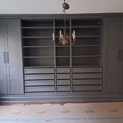Fully installed Ikea Pax cabinets over the custom base with all trim installed Photo