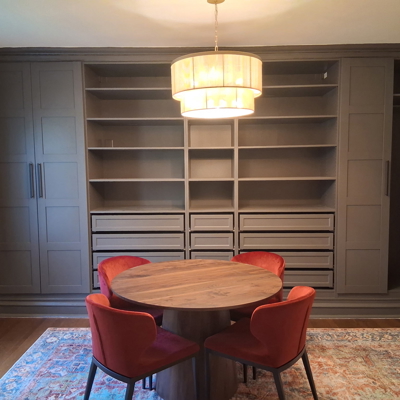Final view of the completed dining room with new light fixture, built in cabinets, and furnishings Photo