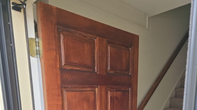 After: A beautifully restored front door, sealed and ready to shine year-round. Photo
