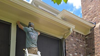 Working on fitting screens to the porch Photo